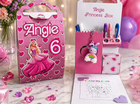Princess-themed gift box with stationery items and a coloring book on a decorative surface.